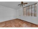 Bedroom featuring terracotta tile flooring, natural light and convenient closet at 1001 Pearce Dr # 106, Clearwater, FL 33764