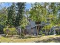 Charming house with a well-kept lawn and garden in front at 206 W Minnehaha St, Tampa, FL 33604