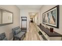 Inviting home hallway featuring light wood floors and stylish decor at 20778 Balsam Hill Rd, Land O Lakes, FL 34638
