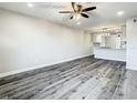 Open-concept living space that flows into a kitchen, complete with stylish wood floors at 2253 Norwegian Dr # 67, Clearwater, FL 33763