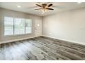 Bright living room with sleek ceiling fan, window, and modern flooring that enhances space at 2253 Norwegian Dr # 67, Clearwater, FL 33763