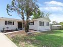 Charming single-story home featuring a well-manicured front yard and walkway at 3094 Vernon Ter, Largo, FL 33770