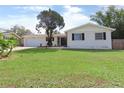 Charming single-story home featuring a well-manicured front yard and attached garage at 3094 Vernon Ter, Largo, FL 33770