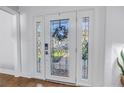 Elegant front door with intricate glass design, enhancing the home's curb appeal and providing a stylish entry at 4514 W Beachway Dr, Tampa, FL 33609
