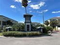 Community sign surrounded by mature landscaping at 521 Vincinda Crest Way, Tampa, FL 33619