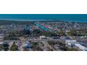 An aerial view showcasing the community, canals, and proximity to the ocean at 7305 Windsor St, Hudson, FL 34667