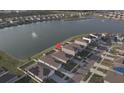Aerial view of home, showcasing the neighborhood pond and location at 7771 Davie Ray Dr, Zephyrhills, FL 33540