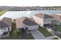 Aerial view of home, showcasing the water view and large backyard at 7771 Davie Ray Dr, Zephyrhills, FL 33540