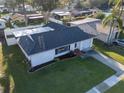 Charming single-story home with a well-manicured lawn, attached garage and lovely landscaping at 811 Helmsman Way, Palm Harbor, FL 34685