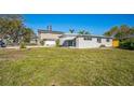 This charming home boasts a well-maintained lawn and a cozy, inviting exterior, perfect for comfortable living at 101 Sunlit Cove Ne Dr, St Petersburg, FL 33702