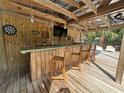 Inviting outdoor bar and entertainment area, complete with a TV and comfortable seating at 2915 67Th Way N, St Petersburg, FL 33710
