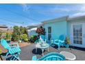 Inviting patio with light blue furniture, perfect for outdoor relaxation and entertaining at 3307 Maitland Dr, Holiday, FL 34691
