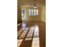 Well-lit living room with a ceiling fan and view to the exterior at 5750 80Th N St # A106, St Petersburg, FL 33709