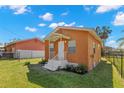 A cozy, single-story home with a quaint front porch and well-maintained landscaping at 6103 Anna Ave, Gibsonton, FL 33534