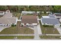 Expansive aerial view showcasing a home with a well-maintained yard and appealing backyard layout at 6339 S Lansdale Cir, Tampa, FL 33616