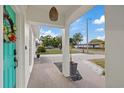 Covered entryway with stone detailing leads into the home, providing a welcoming first impression at 6339 S Lansdale Cir, Tampa, FL 33616