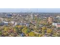 Breathtaking aerial view showcasing the city skyline, surrounding neighborhoods, and lush greenery at 14211 Shadow Moss Ln # 101, Tampa, FL 33613