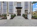 Elegant building entrance featuring a decorative gate, manicured landscaping, and a prominent address display at 226 5Th N Ave # 901, St Petersburg, FL 33701