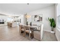 Elegant dining area with stylish table and chairs, complemented by modern lighting and decor at 3579 Sweet Mabolo St, Wesley Chapel, FL 33543