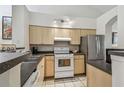 Efficient kitchen with modern appliances and ample cabinet space, perfect for cooking and entertaining at 3638 Trafalgar Way # 103, Palm Harbor, FL 34685