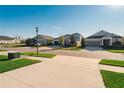 A quiet residential street features well-maintained lawns and attractive single-Gathering homes at 5807 Silver Sun Dr, Apollo Beach, FL 33572