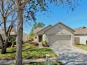 Inviting single-level home with a two-car garage and neatly landscaped front yard at 7853 Bristol Park Dr, Apollo Beach, FL 33572