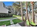Serene community with mature trees and landscaped common areas at 11308 Grandville Dr, Temple Terrace, FL 33617