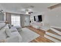 Comfortable living room with a modern TV and minimalist decor at 11308 Grandville Dr, Temple Terrace, FL 33617