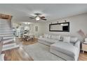 Bright and airy living room featuring hardwood floors and neutral decor at 11308 Grandville Dr, Temple Terrace, FL 33617