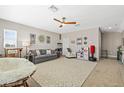 Spacious bonus room with a ceiling fan, neutral walls, and carpet floors, perfect for Gathering entertainment at 1435 Montgomery Bell Rd, Wesley Chapel, FL 33543