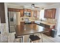 Well-appointed kitchen featuring stainless steel appliances, a large island, and bright lighting at 1509 Lemon St, Clearwater, FL 33756