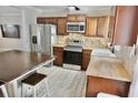 Modern kitchen with stainless steel appliances, butcher block countertops, and abundant cabinetry at 1509 Lemon St, Clearwater, FL 33756