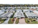 Aerial view of a well-maintained manufactured home community with lush landscaping at 36745 Kimela Ave, Zephyrhills, FL 33542