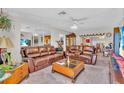 Cozy living room featuring plush leather sofas and a decorative coffee table at 8490 7Th N Ln, St Petersburg, FL 33702
