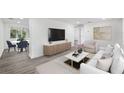 Open-concept living space with modern furniture and stylish decor at 1109 Landau St, Holiday, FL 34690