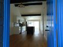 Modern kitchen boasts white cabinets, stainless steel appliances, a black backsplash, and a dark marble island at 16147 Sagebrush Rd, Tampa, FL 33618