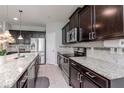 Spacious kitchen with stainless steel appliances, granite countertops, and ample cabinet space at 2208 Landside Dr, Valrico, FL 33594