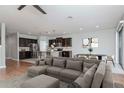Open-concept living space with modern furniture, stylish décor, and a view of the kitchen and dining area at 2208 Landside Dr, Valrico, FL 33594