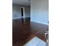 Bright living room featuring wood floors, light-colored walls, and a doorway to other rooms at 2484 Roberta St, Largo, FL 33771
