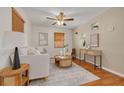 Bright living room with wood floors, a modern sofa, and stylish decor at 358 51St N Ave, St Petersburg, FL 33703