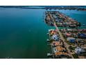 An aerial view of a coastal neighborhood with waterfront homes and private docks on a clear, sunny day at 4998 62Nd S Ave, St Petersburg, FL 33715