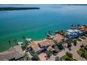 Beautiful waterfront home featuring a private dock, lush landscaping, and picturesque views from above at 4998 62Nd S Ave, St Petersburg, FL 33715