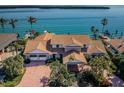 Expansive waterfront estate boasting a private dock, lush landscaping, and breathtaking views from above at 4998 62Nd S Ave, St Petersburg, FL 33715