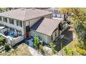 A charming exterior angle highlighting the back side of the property including the backyard, patio, and private courtyard at 6218 Greenleaf Ln # 6218, Temple Terrace, FL 33617