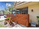 Inviting front yard with a wooden fence and a variety of potted plants at 12738 Wood Trail Blvd, Tampa, FL 33625