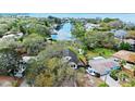 Waterfront home featuring a private dock and serene water views at 3327 Pineview Dr, Holiday, FL 34691