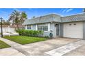 Well-maintained single story home featuring a clean driveway and a tidy, green front yard at 504 Cara Ct # 504, Largo, FL 33771