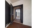 Exterior entryway featuring neutral paint, security doors, and tiled floors at 700 Starkey Rd # 1111, Largo, FL 33771