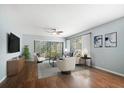 Bright living room with hardwood floors, neutral walls, and natural light at 700 Starkey Rd # 1111, Largo, FL 33771