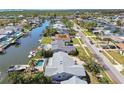 Waterfront neighborhood with homes situated along a canal, many featuring private pools and docks at 8448 Flagstone Dr, Tampa, FL 33615